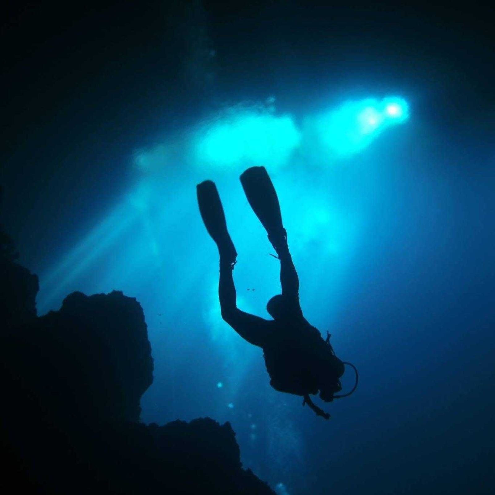 Martin scuba diving in an underwater cave